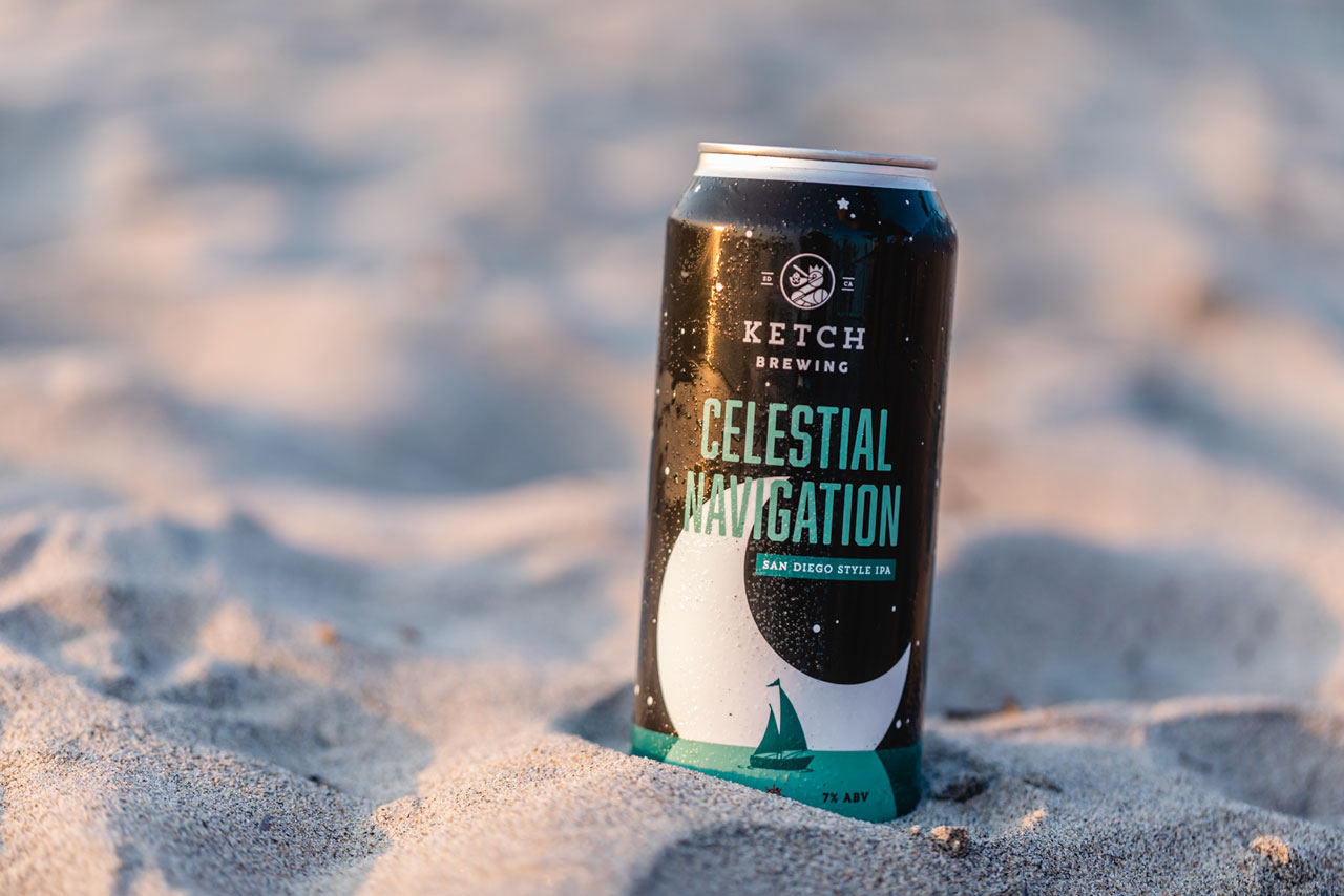 can of ketch celestial navigation sitting in sand with light from sunset