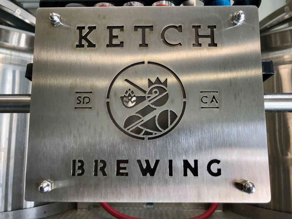 ketch logo punched out of metal sign